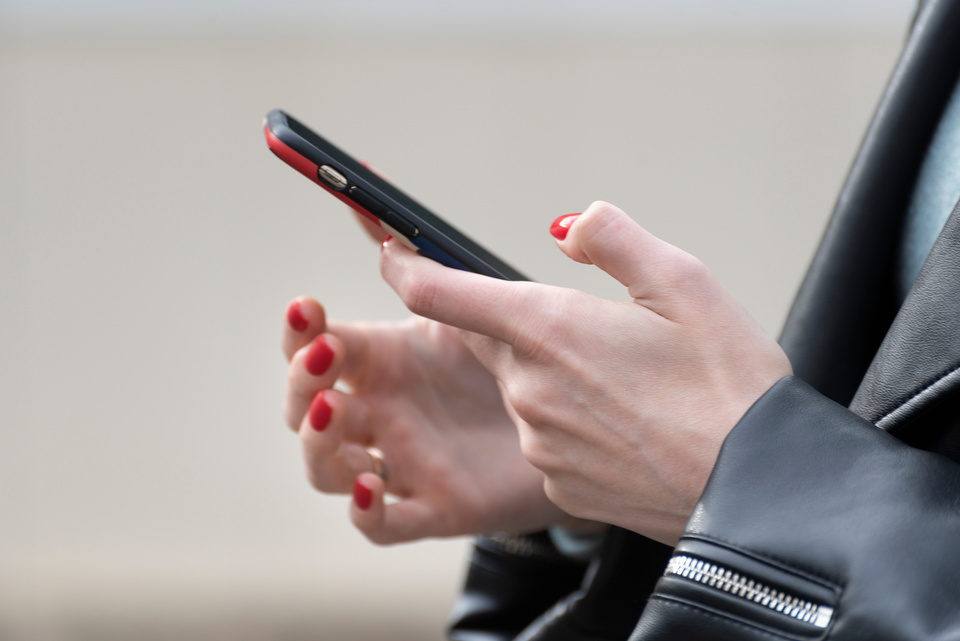 Woman Holding Smartphone